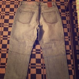 Blue regular fit jean. Zipper closure. Brand New!